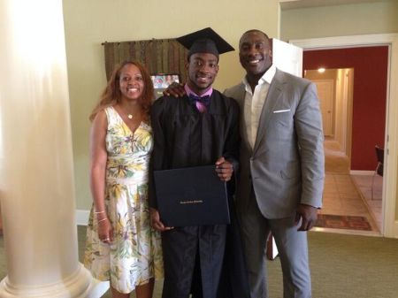 Shannon Sharpe poses a picture with his son Kieri Sharpe at his graduation.